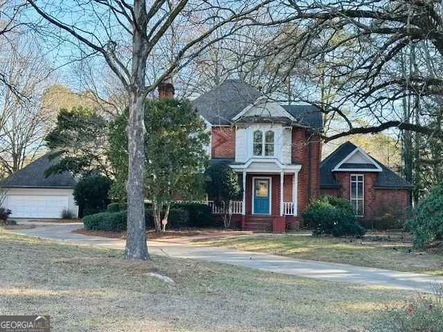 MOVE IN READY Victorian Home on 1.28 Acres with 2 Garages